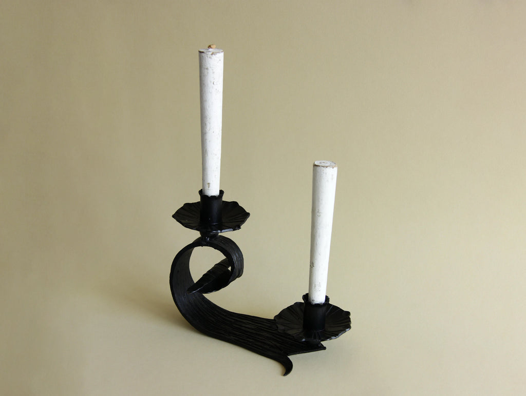 1970s hand-forged iron candle holder, three-quarter view
