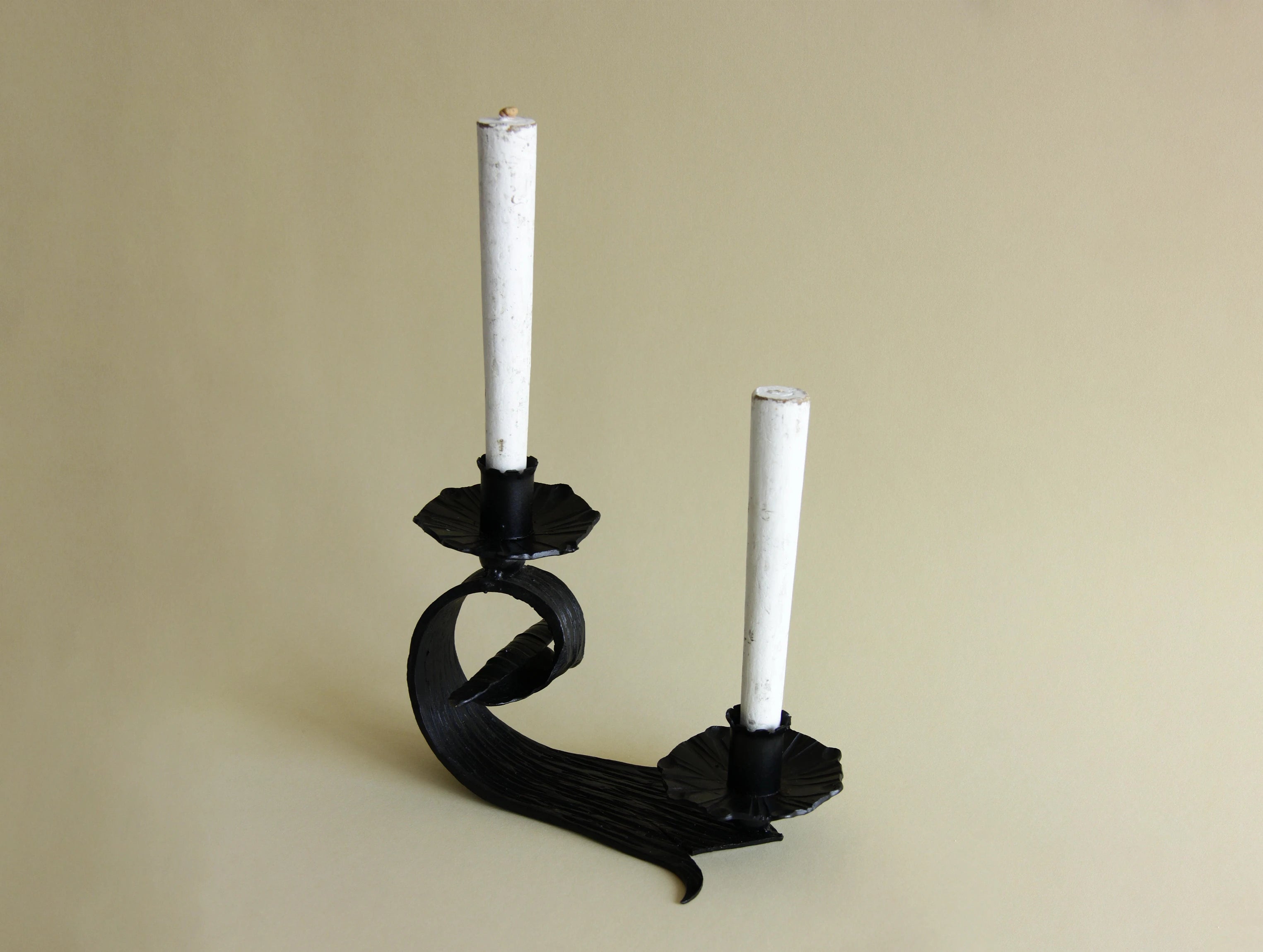1970s hand-forged iron candle holder, three-quarter view