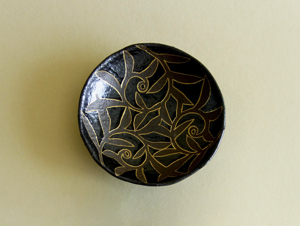 Black-glaze and gilt floral dish, front view