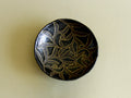 Black-glaze and gilt floral dish, front view