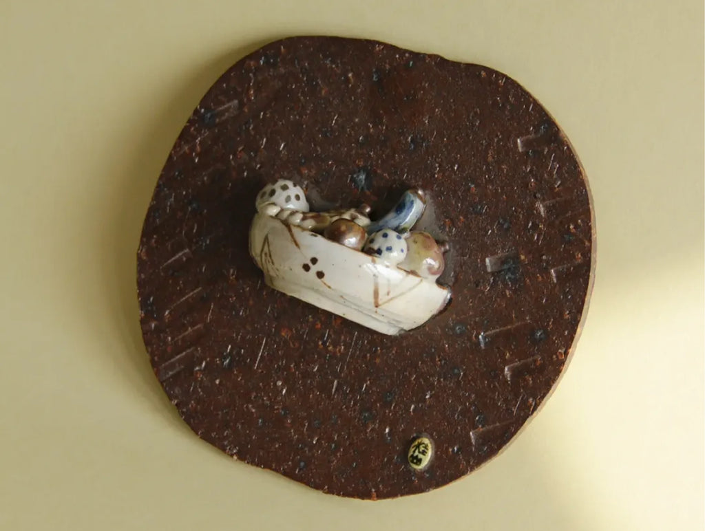 Kazufumi Wada ceramic wall plaque, side view