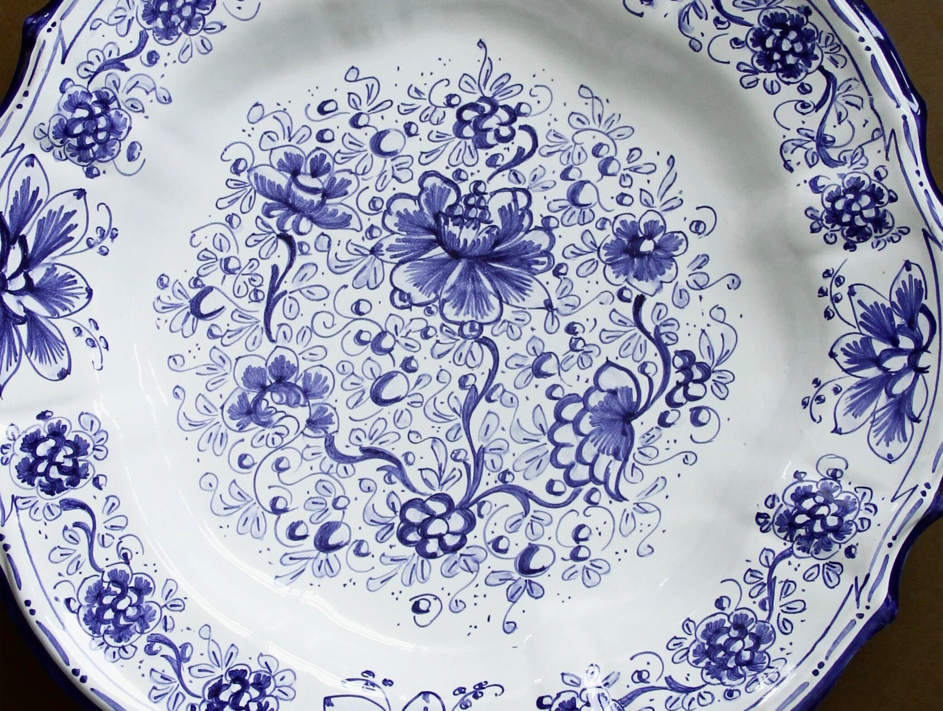 Majolica cobalt floral display plate, three-quarter view