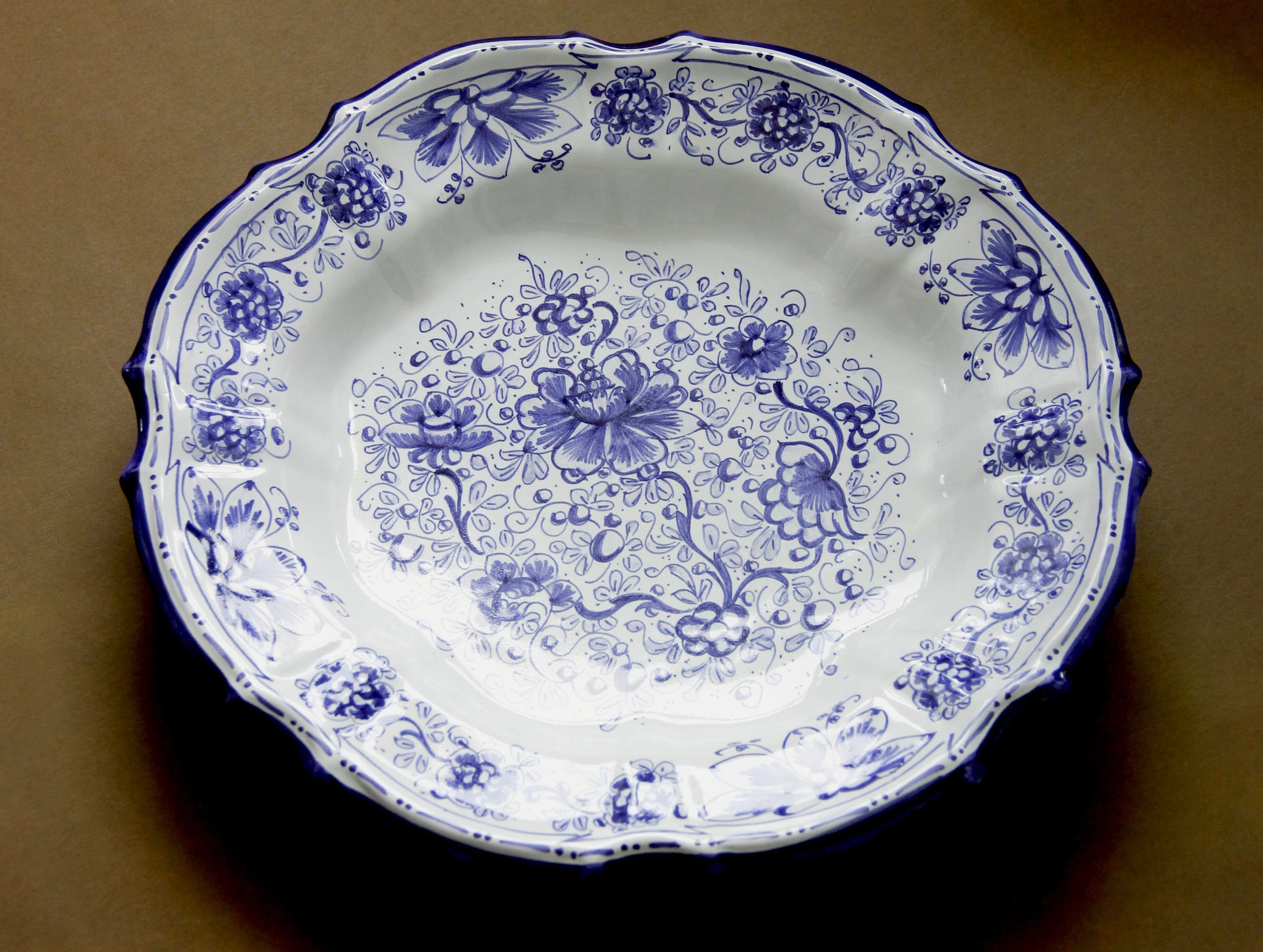 Majolica cobalt floral display plate, surface detail