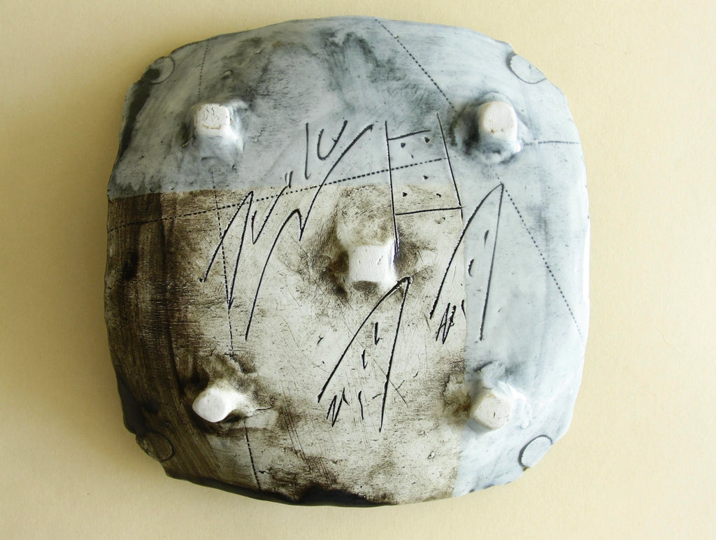 Weathered blue abstract geometric plate, surface detail