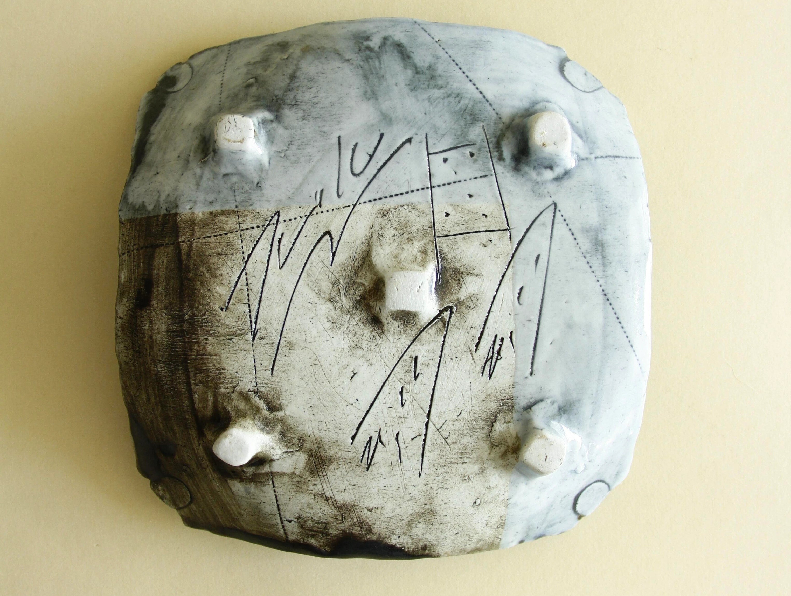 Weathered blue abstract geometric plate, surface detail