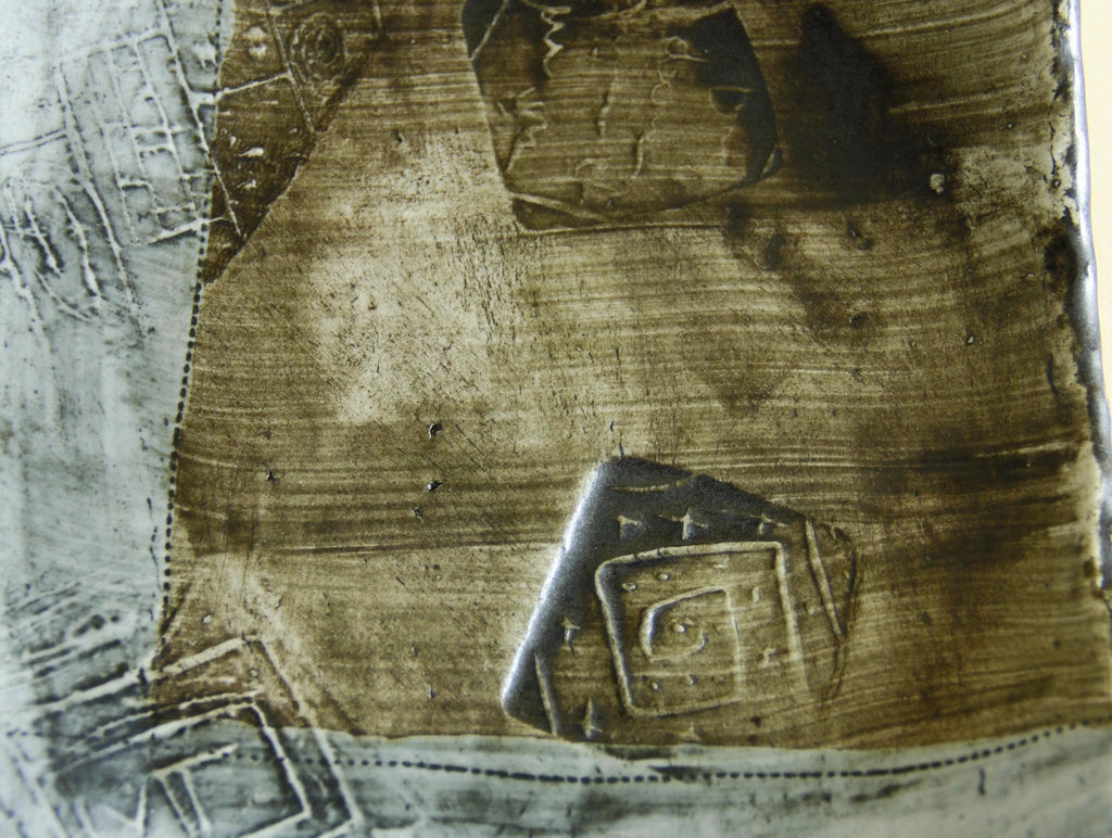 Weathered blue abstract geometric plate, scale and form